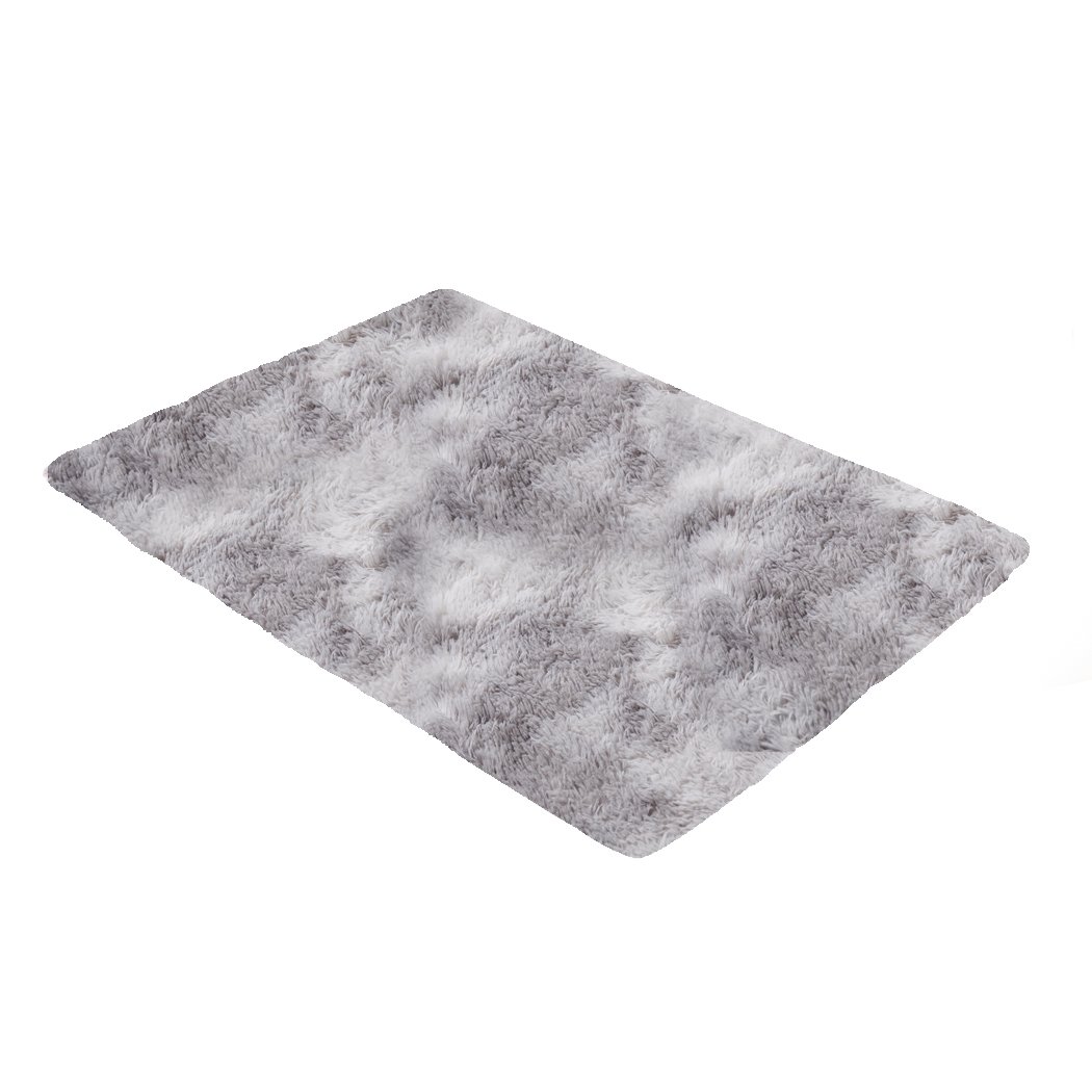 A large tie-dyed shaggy rug measuring 120x160cm, featuring a soft, plush surface and an anti-slip silicone bottom, perfect for home decor.