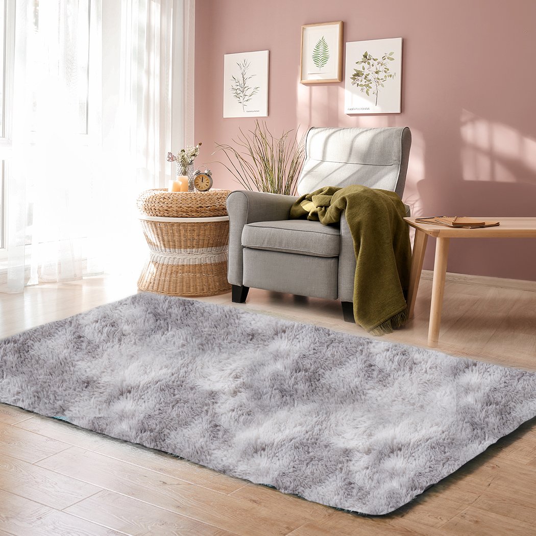 A large tie-dyed shaggy rug measuring 120x160cm, featuring a soft, plush surface and an anti-slip silicone bottom, perfect for home decor.