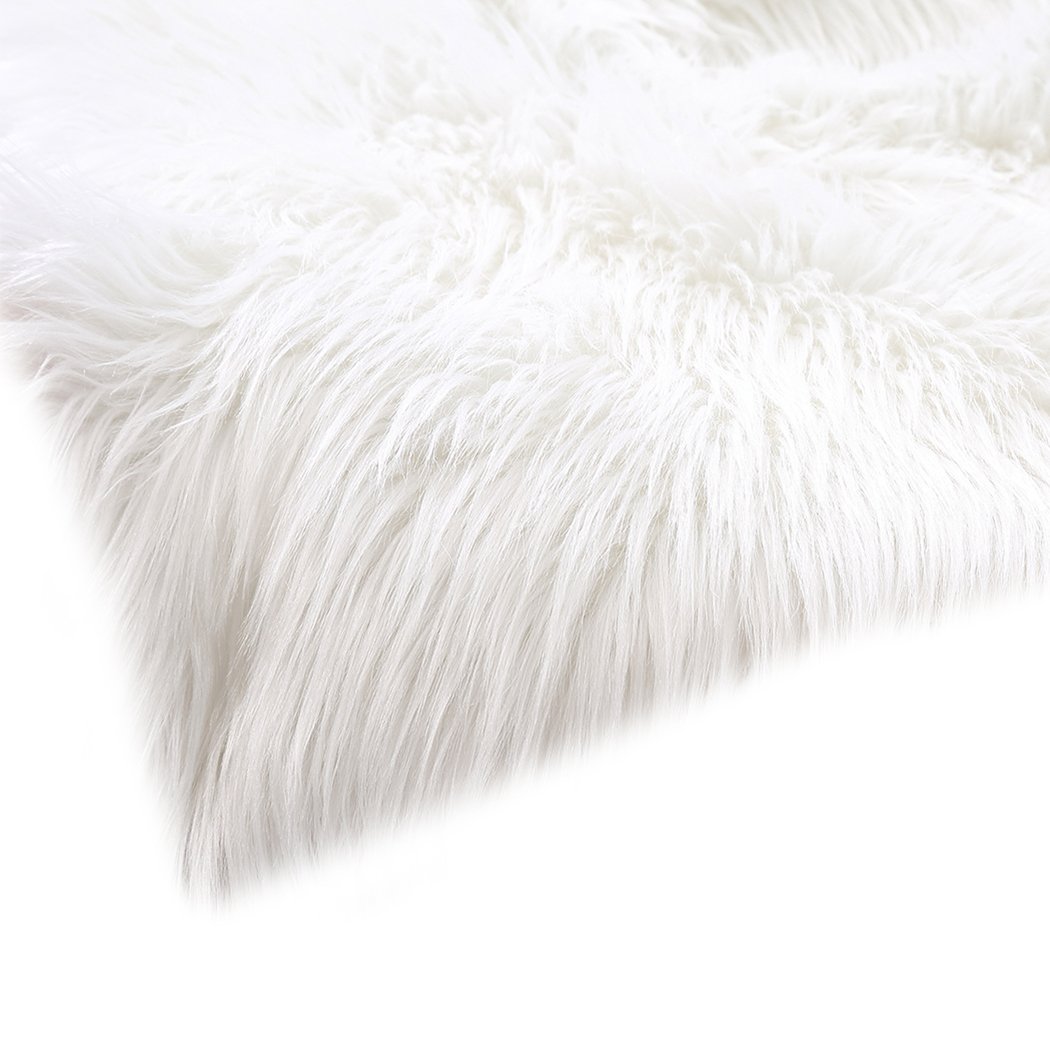 Luxurious white sheepskin shaggy rug with a plush 60-70mm pile, perfect for enhancing comfort in living rooms and bedrooms.