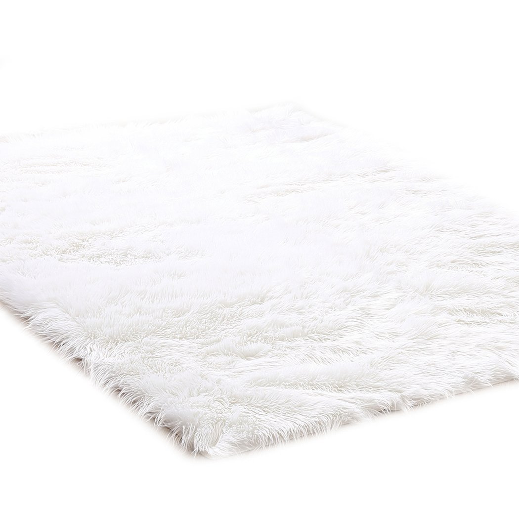 Luxurious white sheepskin shaggy rug with a plush 60-70mm pile, perfect for enhancing comfort in living rooms and bedrooms.