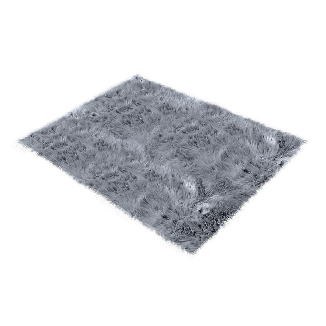 Luxurious dark grey sheepskin shaggy rug measuring 60x120 cm, perfect for bedroom or living room decor.