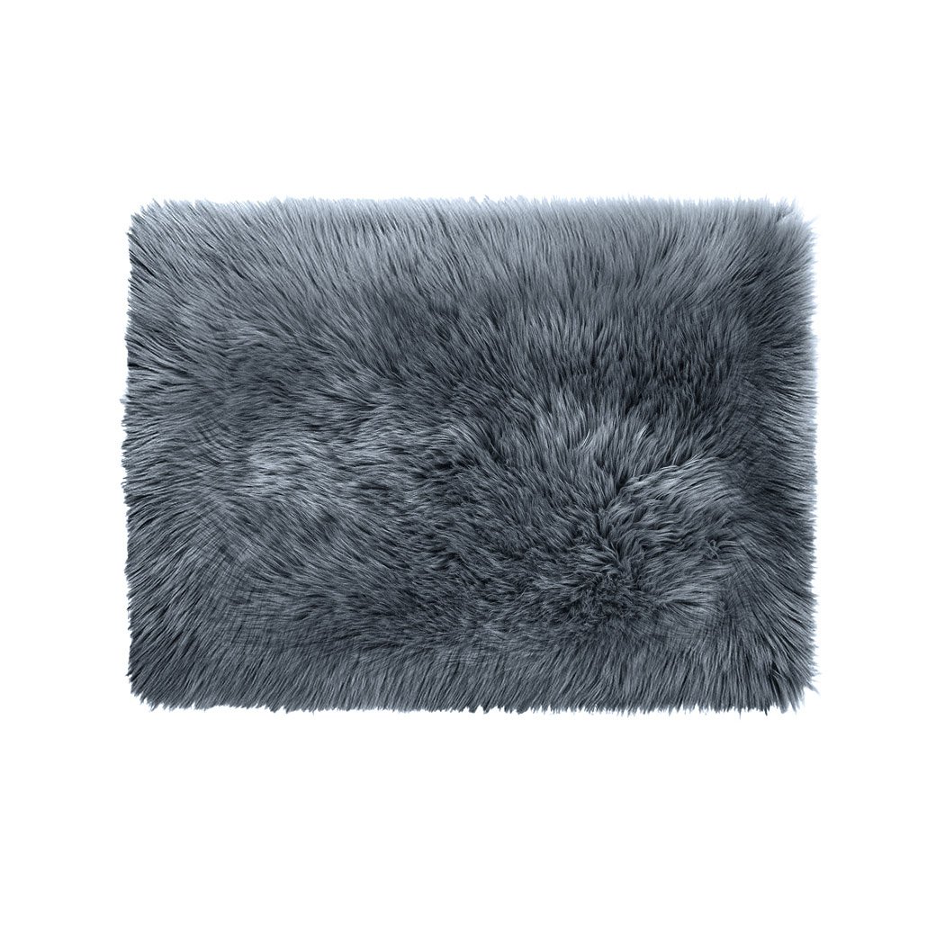 Luxurious dark grey sheepskin shaggy rug measuring 60x120 cm, perfect for bedroom or living room decor.