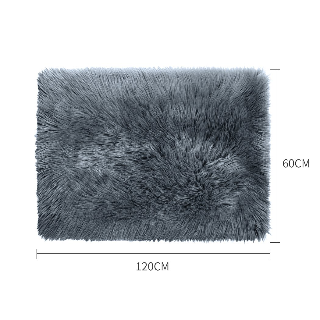 Luxurious dark grey sheepskin shaggy rug measuring 60x120 cm, perfect for bedroom or living room decor.