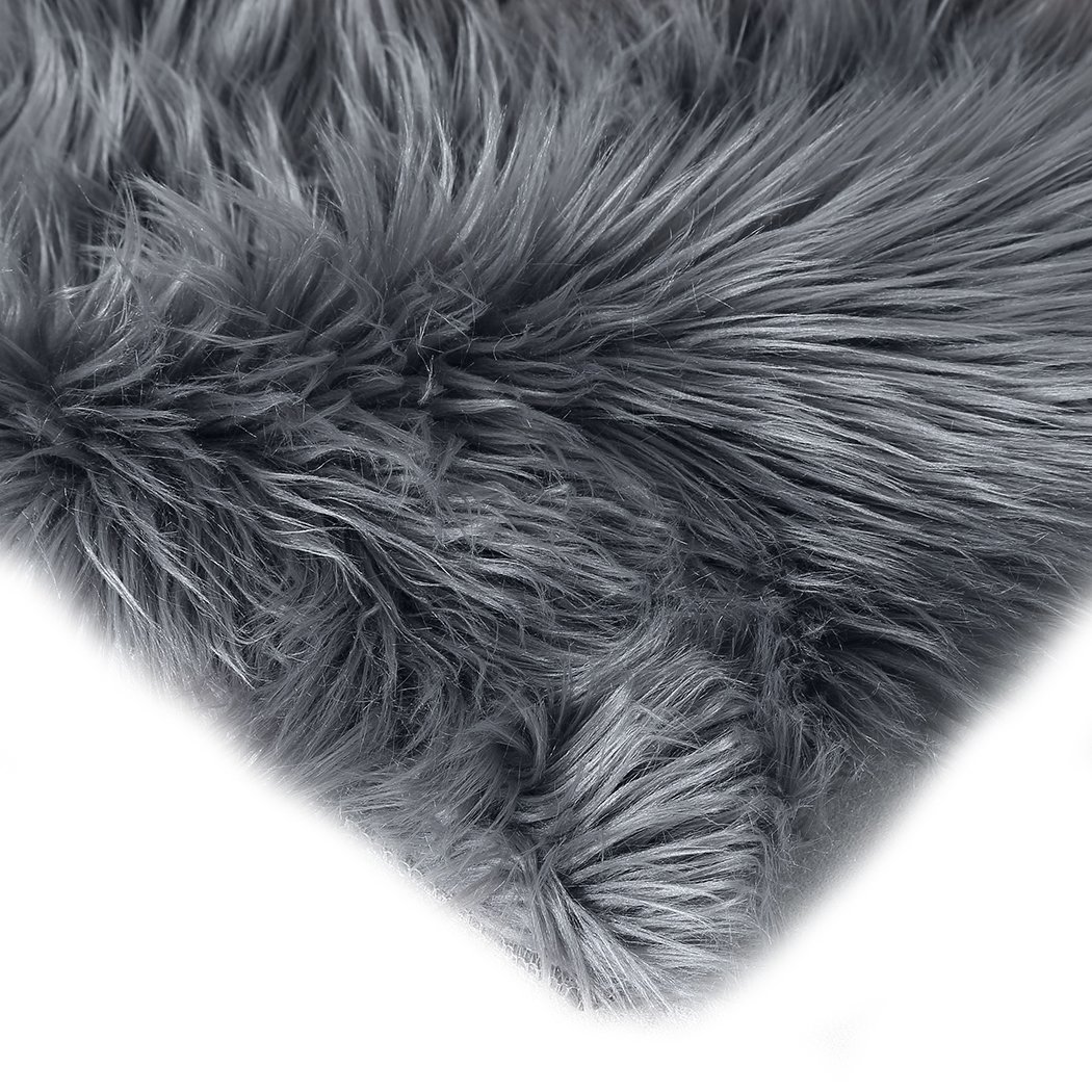 Luxurious dark grey sheepskin shaggy rug measuring 60x120 cm, perfect for bedroom or living room decor.