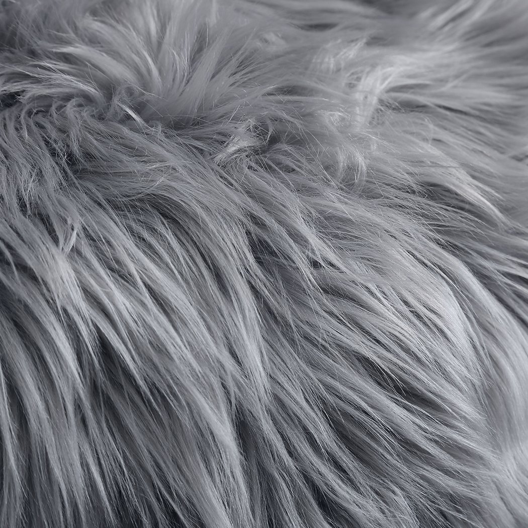 Luxurious dark grey sheepskin shaggy rug measuring 60x120 cm, perfect for bedroom or living room decor.