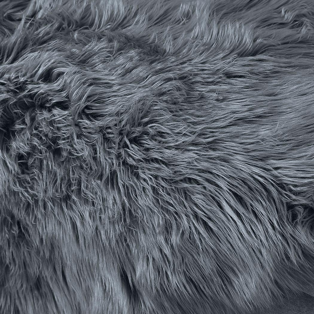 Luxurious dark grey sheepskin shaggy rug measuring 60x120 cm, perfect for bedroom or living room decor.