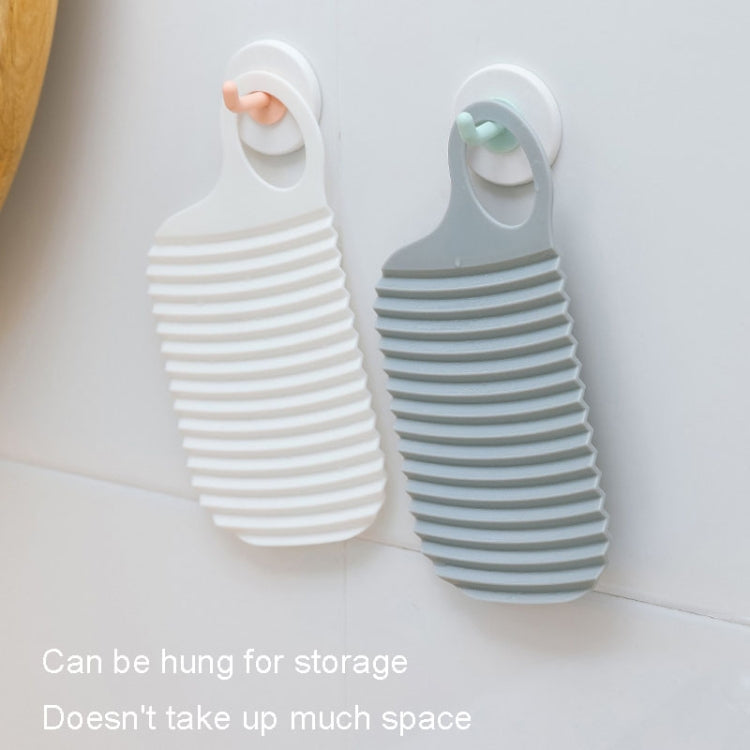 Foldable Soft Silicone Laundry Board in white, featuring a smooth surface and convenient hanging holes for easy storage.