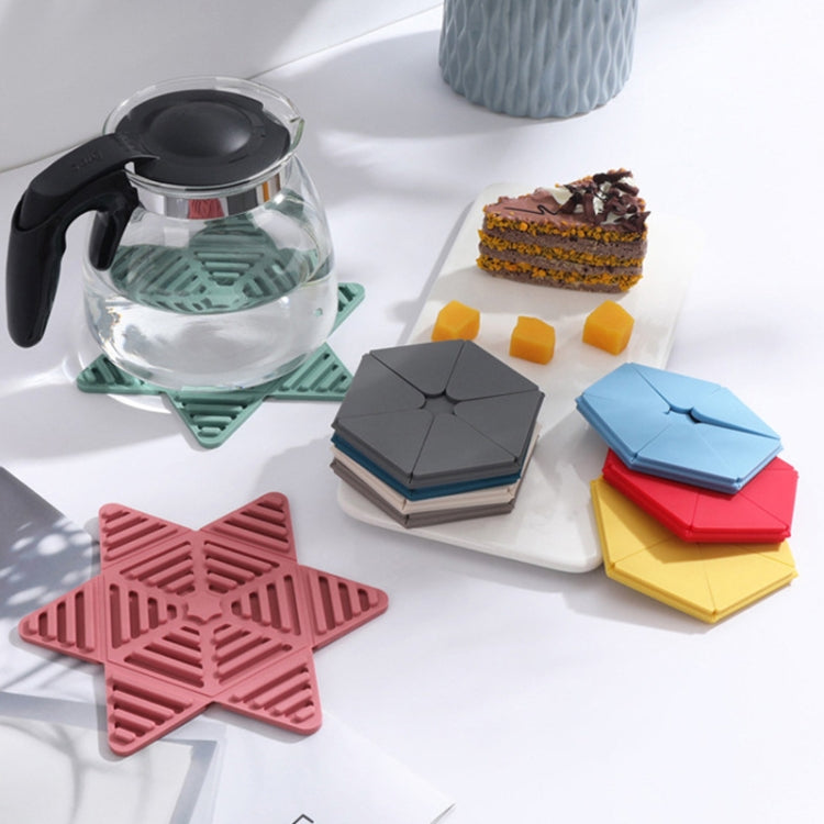 Folding Pot Cushion Silicone Tea Cup Insulation Pad in various colors, showcasing its flexible and foldable design for heat protection.