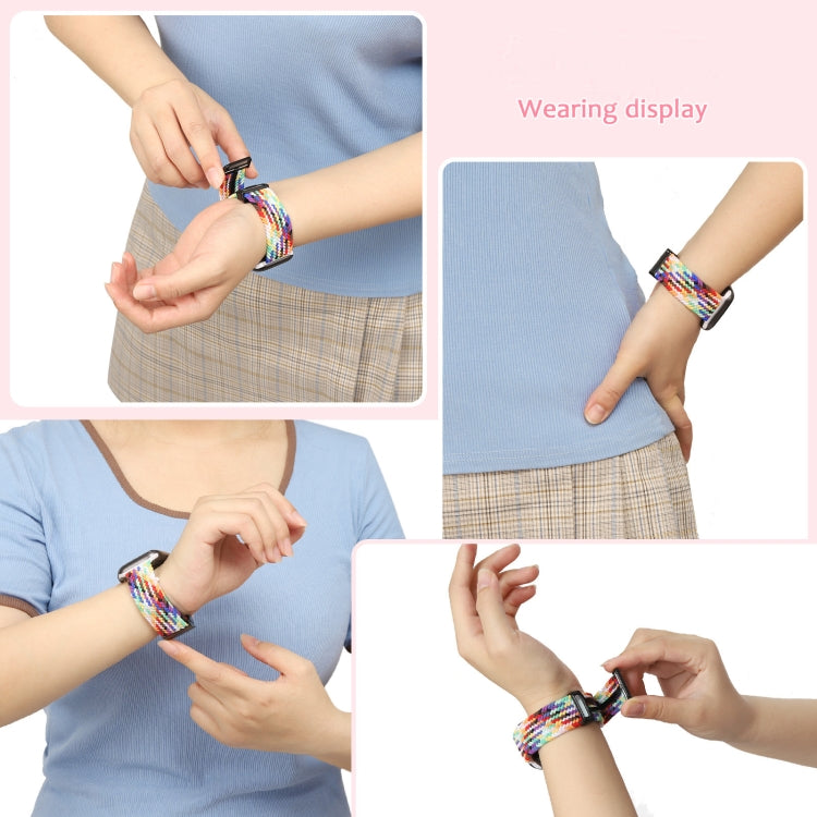 Person wearing colorful wristband watch