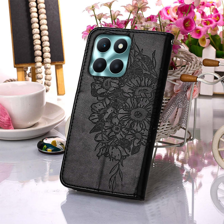 For Honor X6a Embossed Butterfly Leather Phone Case in black, showcasing its elegant design and functional features.