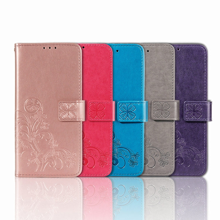 Blue embossed leather phone case for Huawei Mate 60 with four-leaf clasp design, showcasing elegance and functionality.