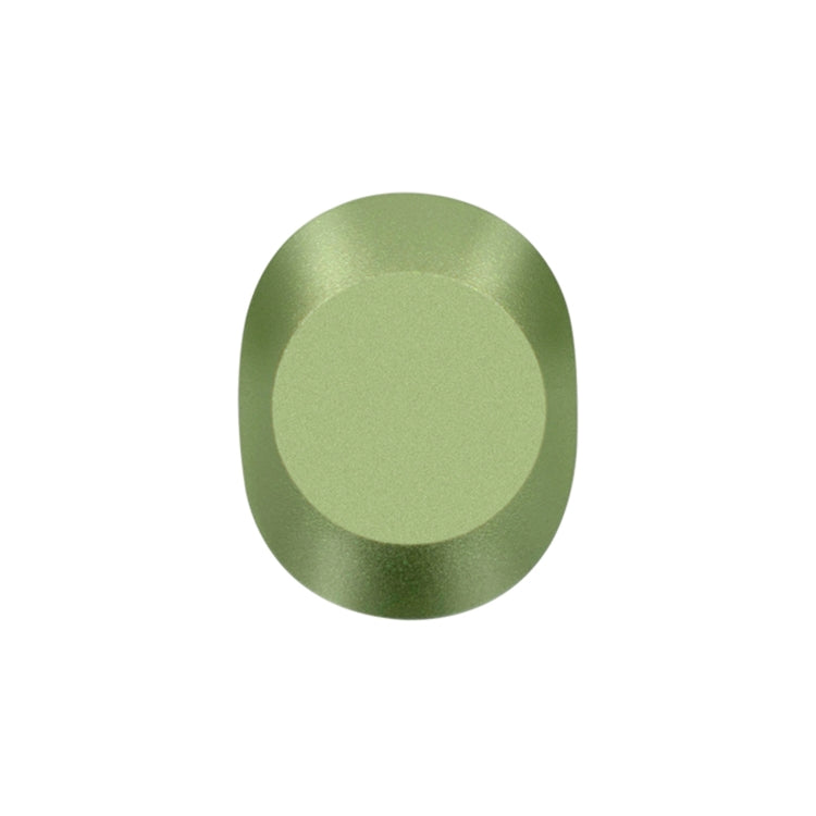 Green metallic knob or dial.