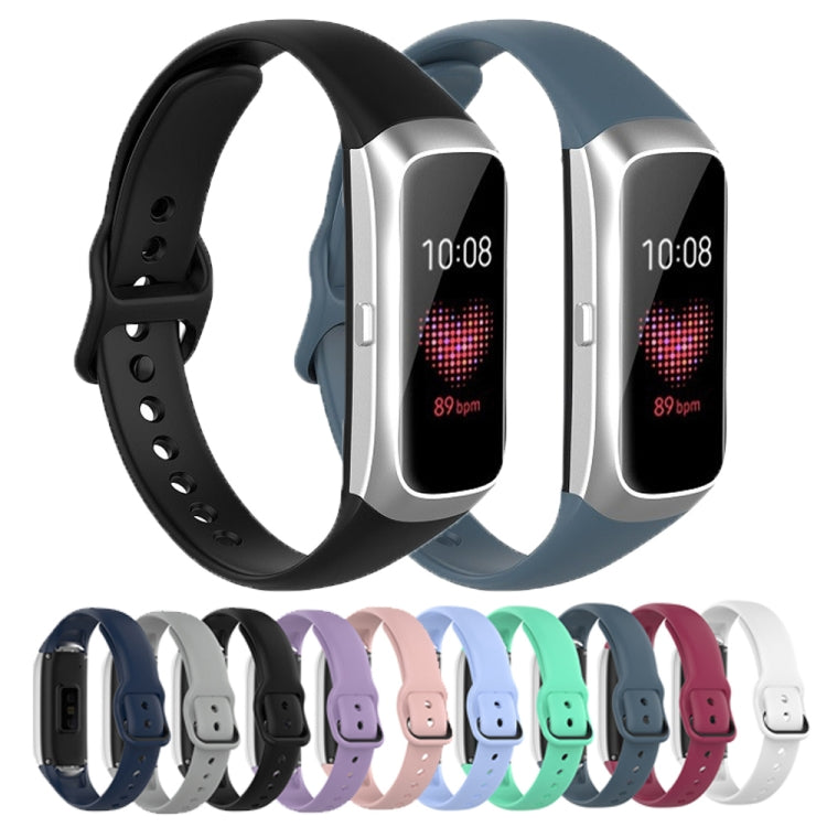 Black silicone strap for Samsung Galaxy Fit SM-R370 with steel shrapnel buckle, showcasing its soft texture and adjustable length.