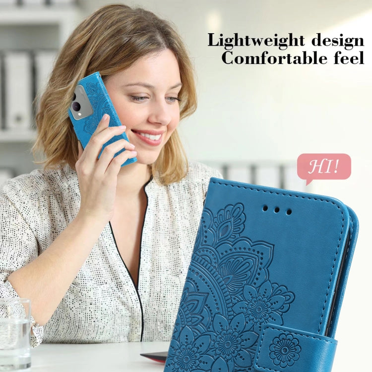 Blue leather phone case for Vivo Y17s with 7-petal flowers embossing, showcasing its stylish design and functionality.