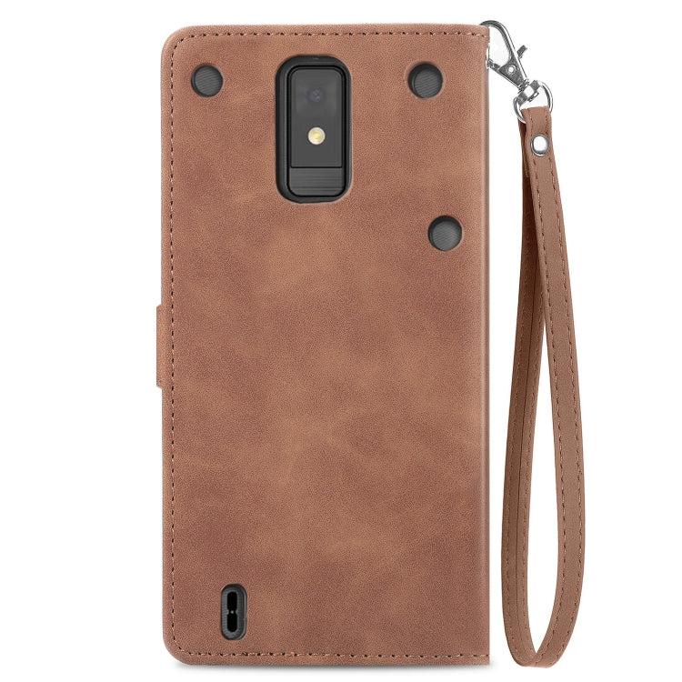 Brown embossed flower zipper leather phone case for ZTE Blade A32, showcasing its elegant design and practical features.