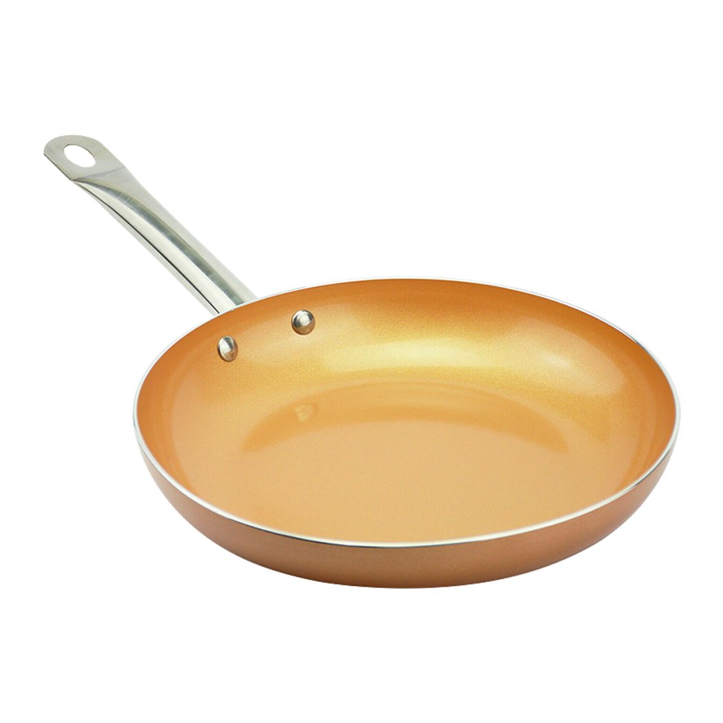 A sleek non-stick stainless steel frying pan with a copper-infused surface, ideal for healthy cooking.