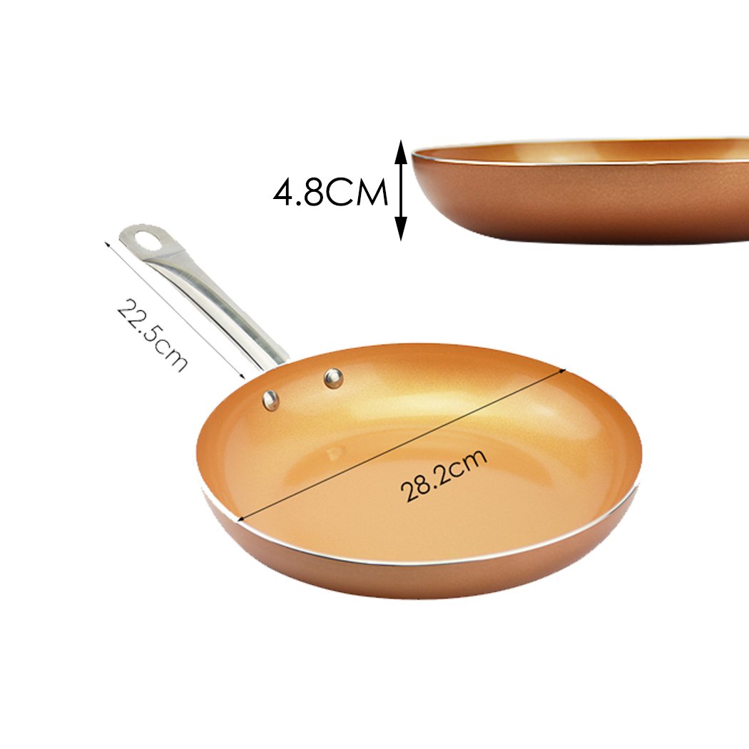 A sleek non-stick stainless steel frying pan with a copper-infused surface, ideal for healthy cooking.