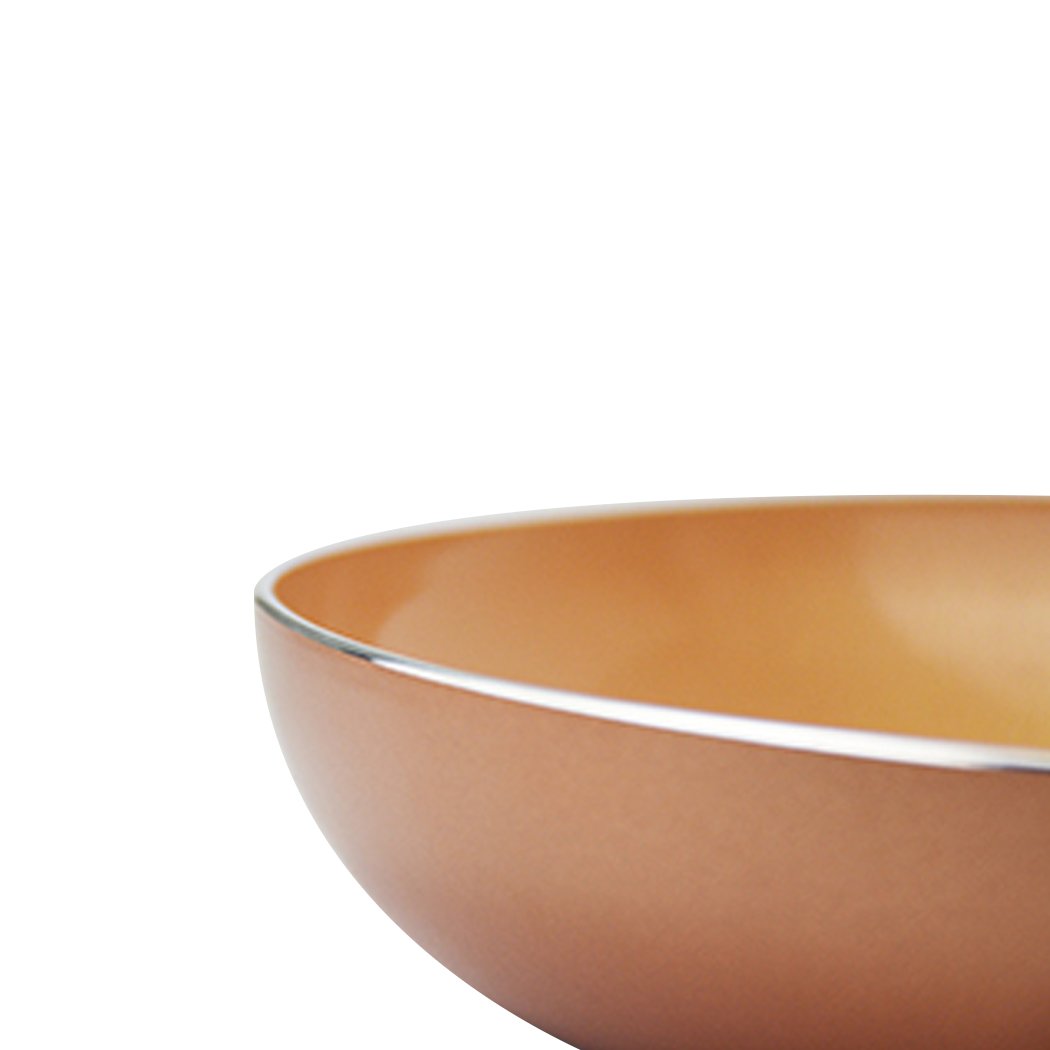 A sleek non-stick stainless steel frying pan with a copper-infused surface, ideal for healthy cooking.