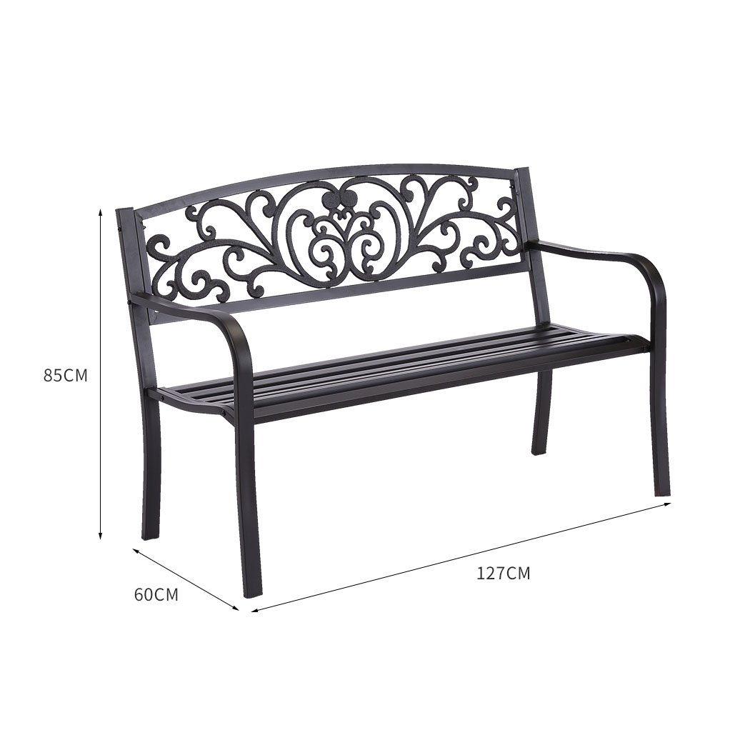 A stylish black garden bench made of galvanized steel and cast iron, featuring a floral backrest and smooth armrests, perfect for outdoor relaxation.