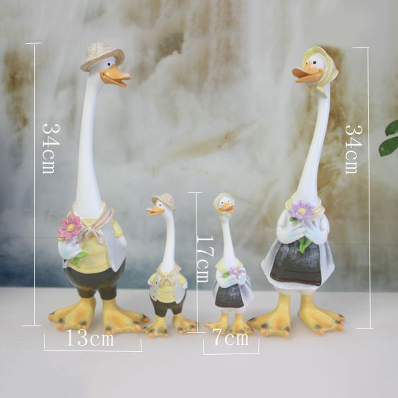 A charming resin duck family figurine set, perfect for garden decoration, showcasing intricate details and vibrant colors.