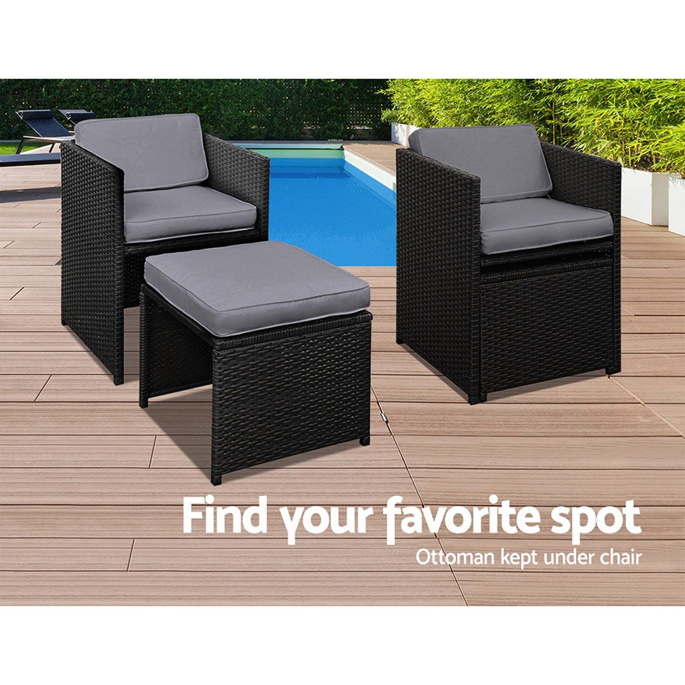 Gardeon 11 Piece PE Wicker Outdoor Dining Set in Black with grey cushions, featuring a glass top table and stylish design.