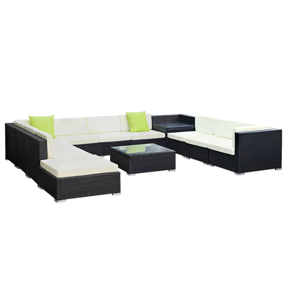 Gardeon 12PC Outdoor Furniture Set featuring wicker sofa lounge with cushions and a glass-top table, perfect for outdoor relaxation.