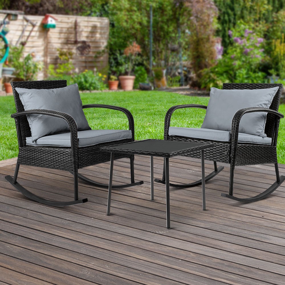 Gardeon 3 Piece Outdoor Chair Rocking Set in black featuring two rocking chairs and a tempered glass side table with cushions.