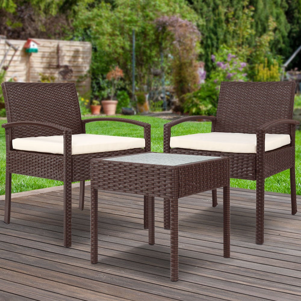 Gardeon 3-piece Outdoor Set featuring brown PE wicker chairs and a side table with a clear tempered glass top, complemented by beige cushions.