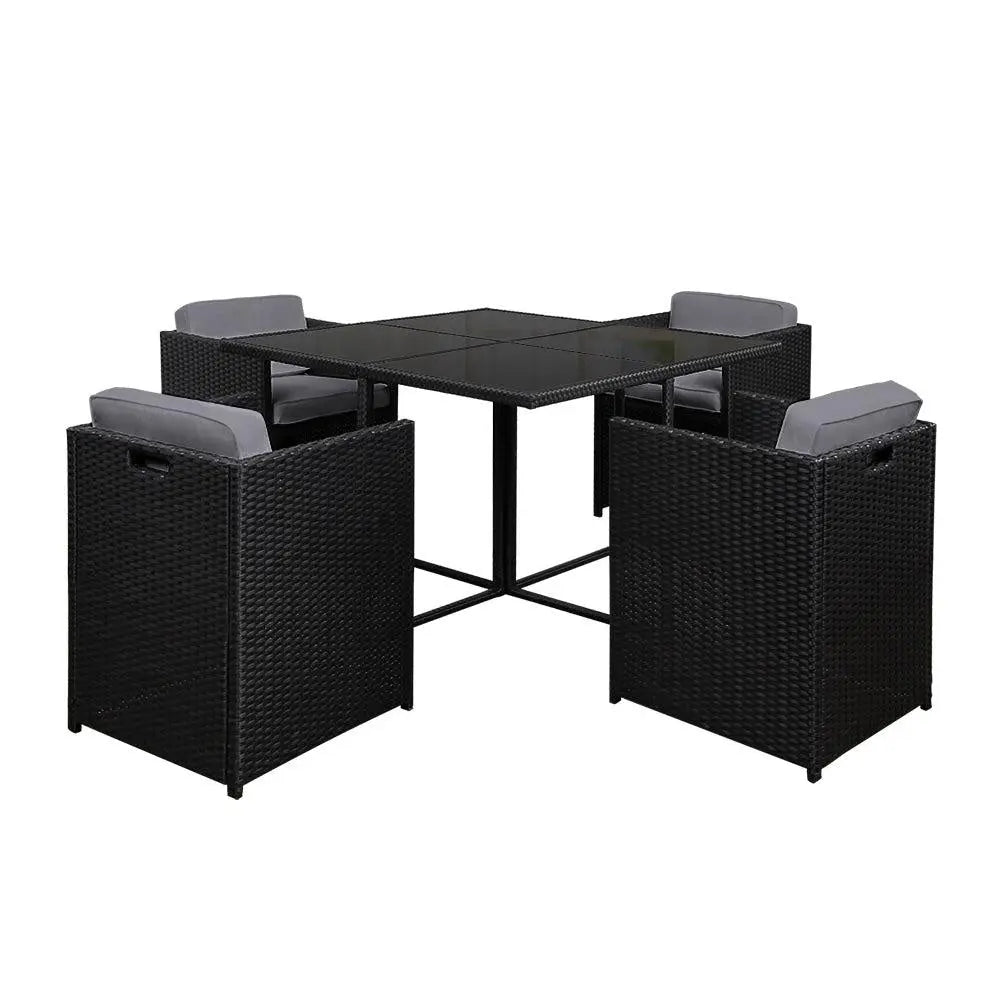 Gardeon 5 Piece Wicker Outdoor Dining Set in Black with grey cushions, featuring a rectangular glass top table and four chairs.