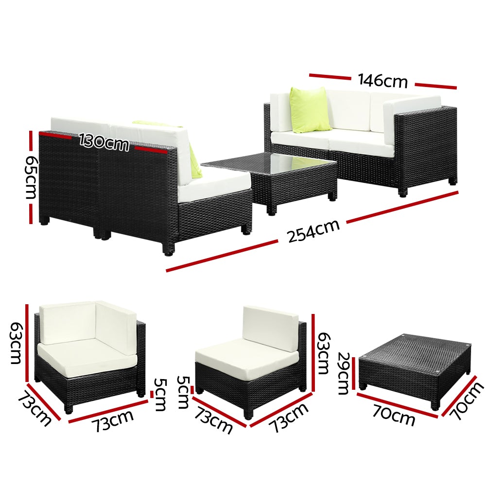 Gardeon 5PC Outdoor Furniture Sofa Set featuring modular wicker couches, a coffee table with tempered glass top, and vibrant cushions in a backyard setting.