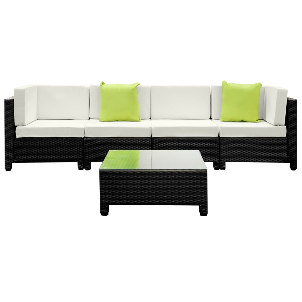 Gardeon 5PC Outdoor Furniture Sofa Set featuring modular wicker couches, a coffee table with tempered glass top, and vibrant cushions in a backyard setting.