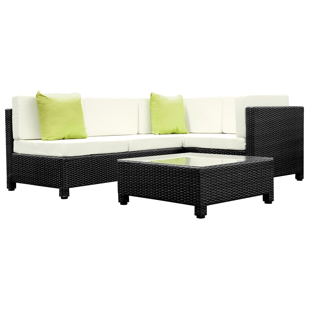 Gardeon 5PC Outdoor Furniture Sofa Set featuring modular wicker couches, a coffee table with tempered glass top, and vibrant cushions in a backyard setting.