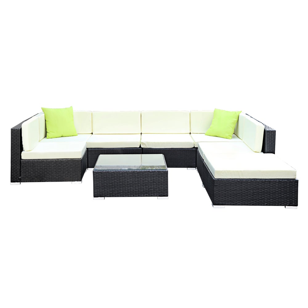 Gardeon 8PC Outdoor Sofa Set featuring black aluminium frame, beige cushions, and lime green throw pillows, with a glass-top table and ottoman.