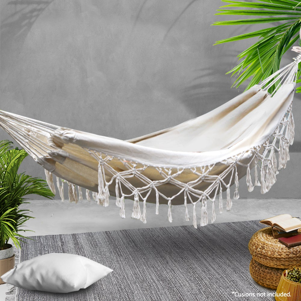 Gardeon Hanging Tassel Hammock Swing Bed in cream color with handcrafted tassels, perfect for indoor and outdoor relaxation.