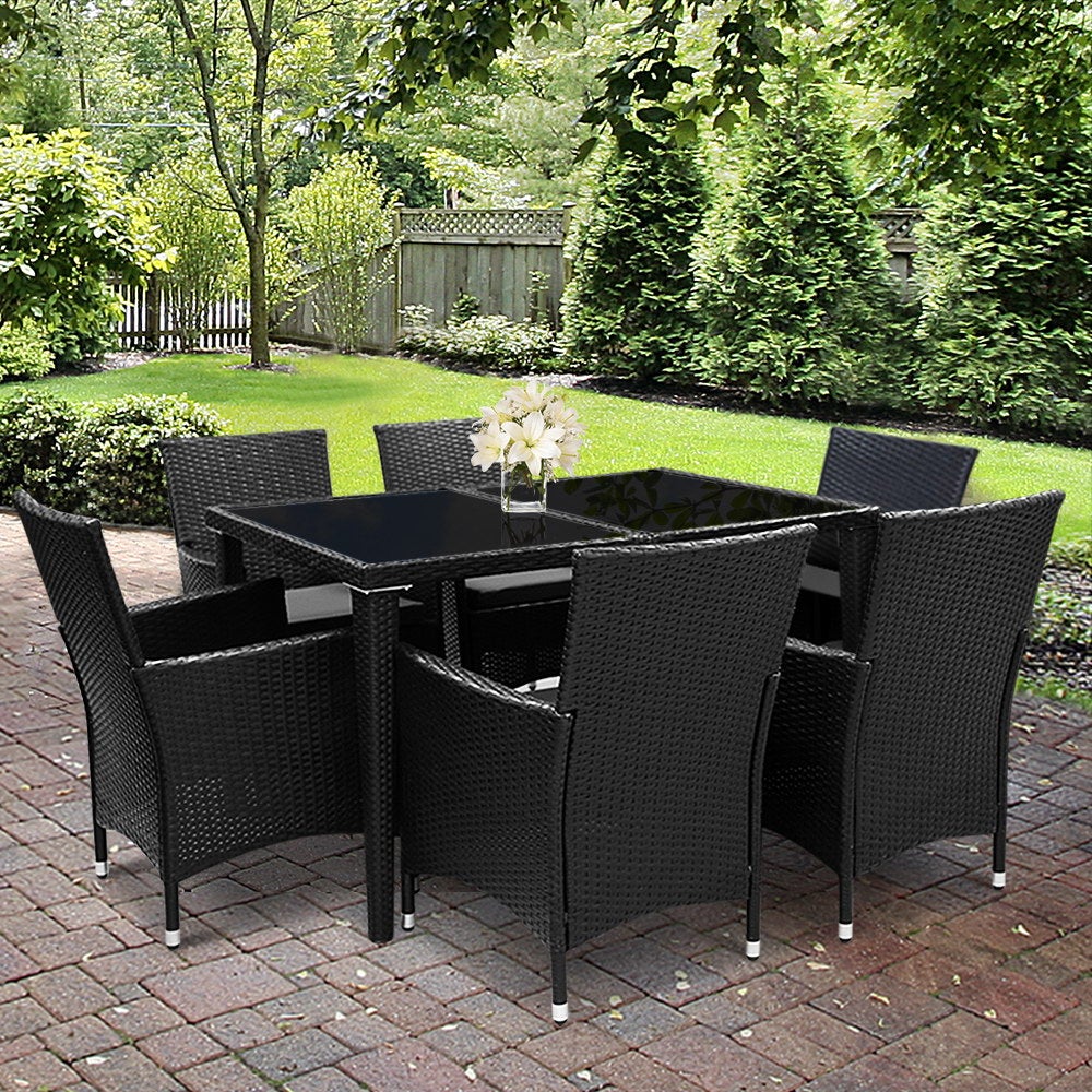 Gardeon Outdoor Furniture 7pcs Dining Set featuring six chairs and a spacious table with a glass top, designed for outdoor dining.