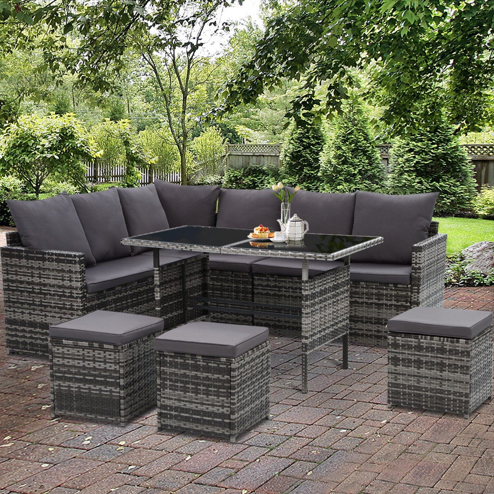 Gardeon Outdoor Furniture Dining Setting Sofa Set featuring a 9-seater wicker design with cushions and a glass-top table, perfect for outdoor gatherings.