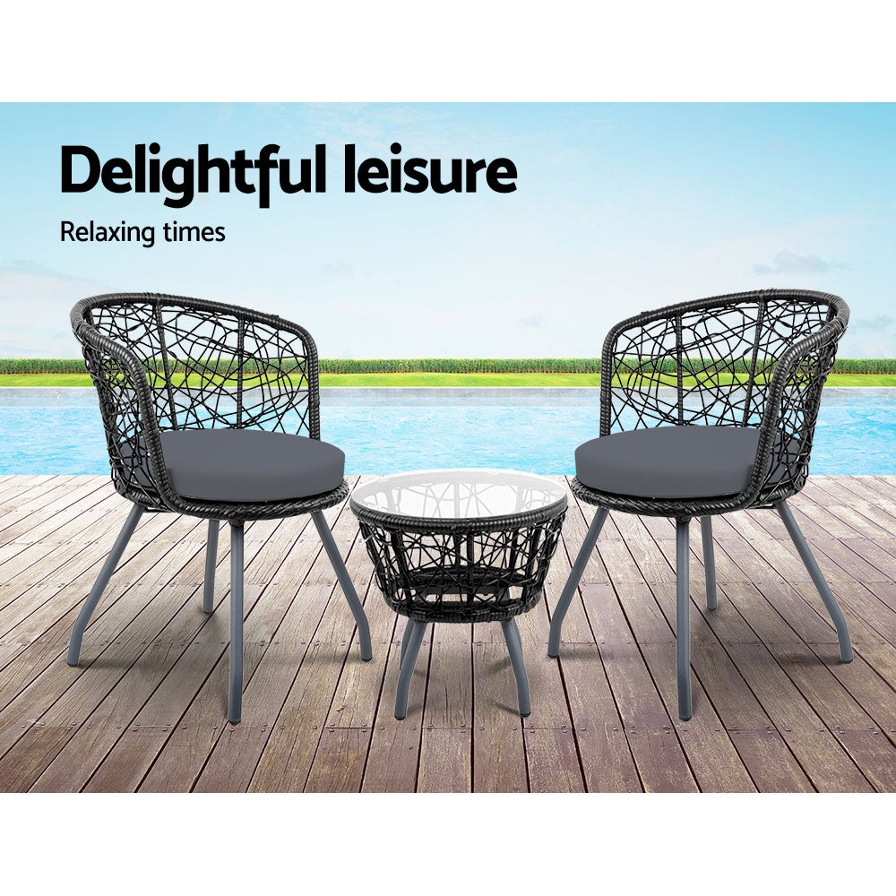 Gardeon Outdoor Patio Chair and Table set in black, featuring two rattan chairs with grey cushions and a matching side table with a glass top.