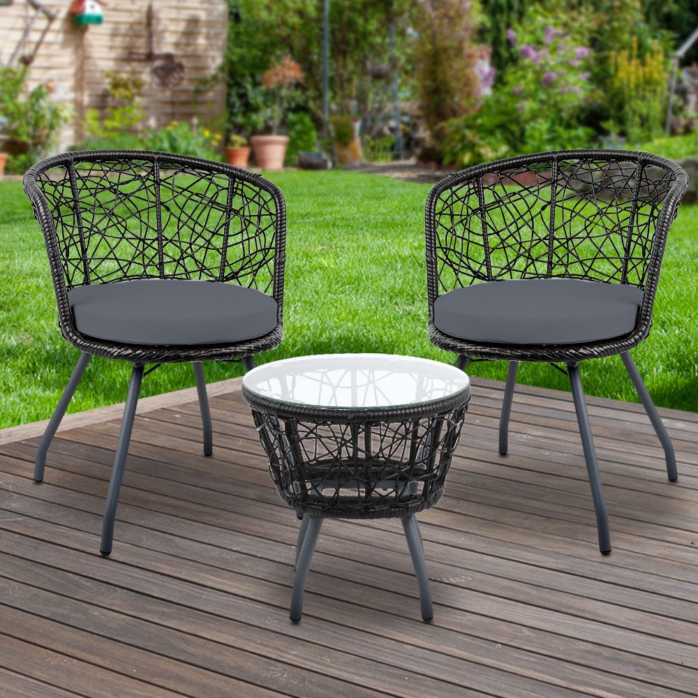 Gardeon Outdoor Patio Chair and Table set in black, featuring two rattan chairs with grey cushions and a matching side table with a glass top.