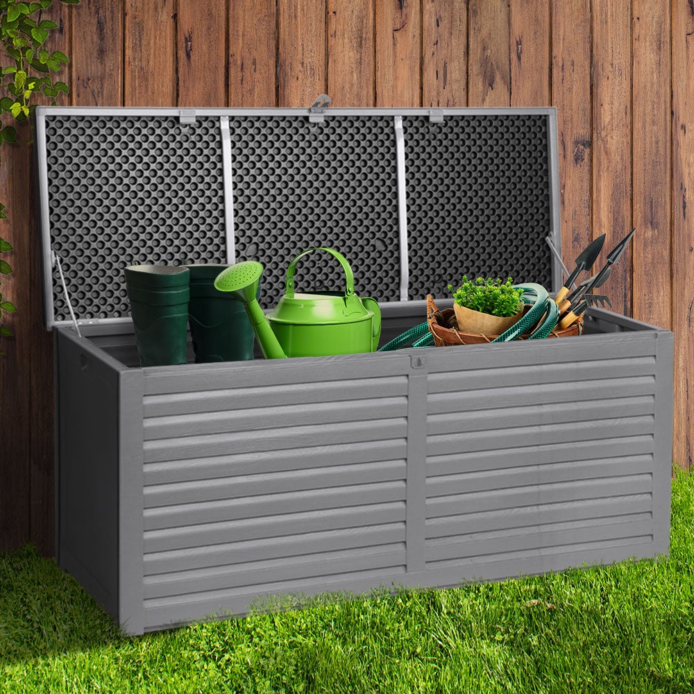 Gardeon Outdoor Storage Box in dark grey, showcasing its large capacity and stylish design, used as a bench seat in a garden setting.