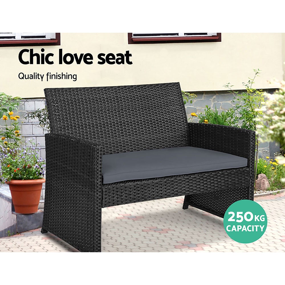 Gardeon Set of 4 Outdoor Wicker Chairs and Table in Black with grey cushions, showcasing a modern design suitable for outdoor and indoor use.