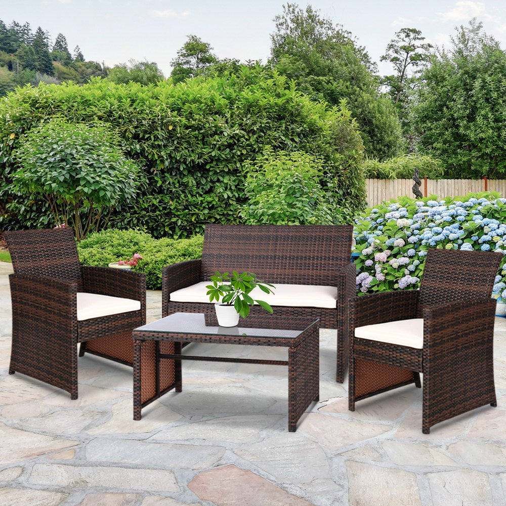 Gardeon Set of 4 Outdoor Wicker Chairs and Table in Brown with beige cushions, showcasing a stylish outdoor seating arrangement.