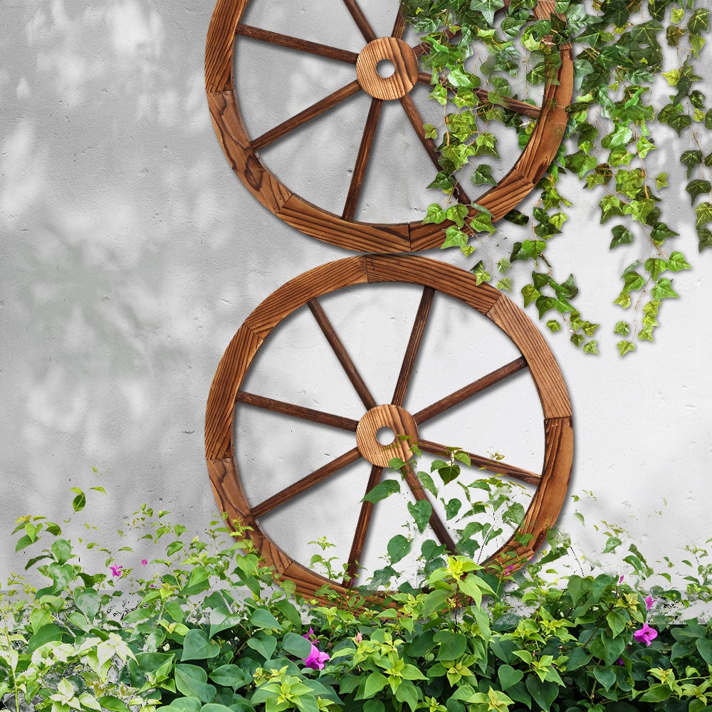 Two Gardeon Wooden Wagon Wheels made of fir wood with a rustic burnt finish, showcasing their vintage charm and sturdy construction.