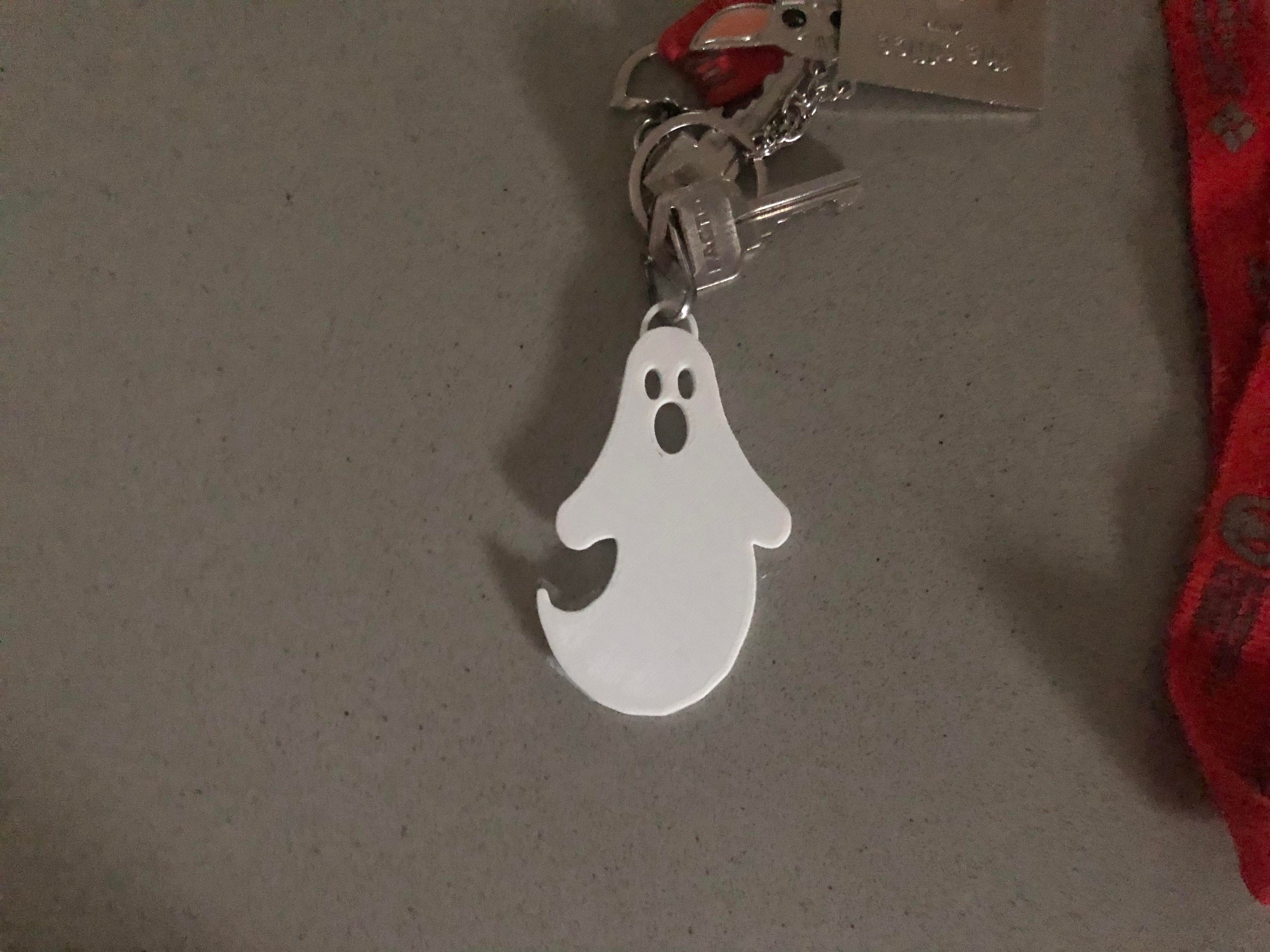 A collection of three unique ghost keychains in various styles, perfect for Halloween gifts and party favors.