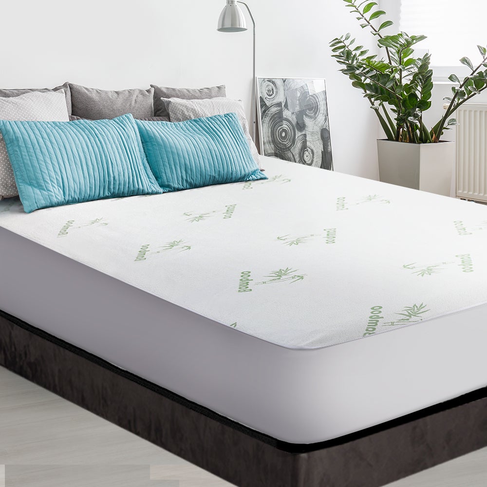 Giselle Bedding Bamboo Mattress Protector in white, showcasing its soft bamboo fabric and elastic skirt for a snug fit.