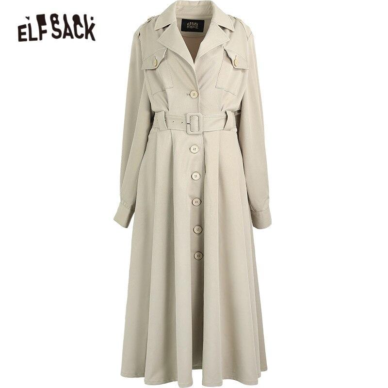 A stylish green oversize trench coat for women, featuring a single-breasted closure and full sleeves, perfect for spring and autumn wear.