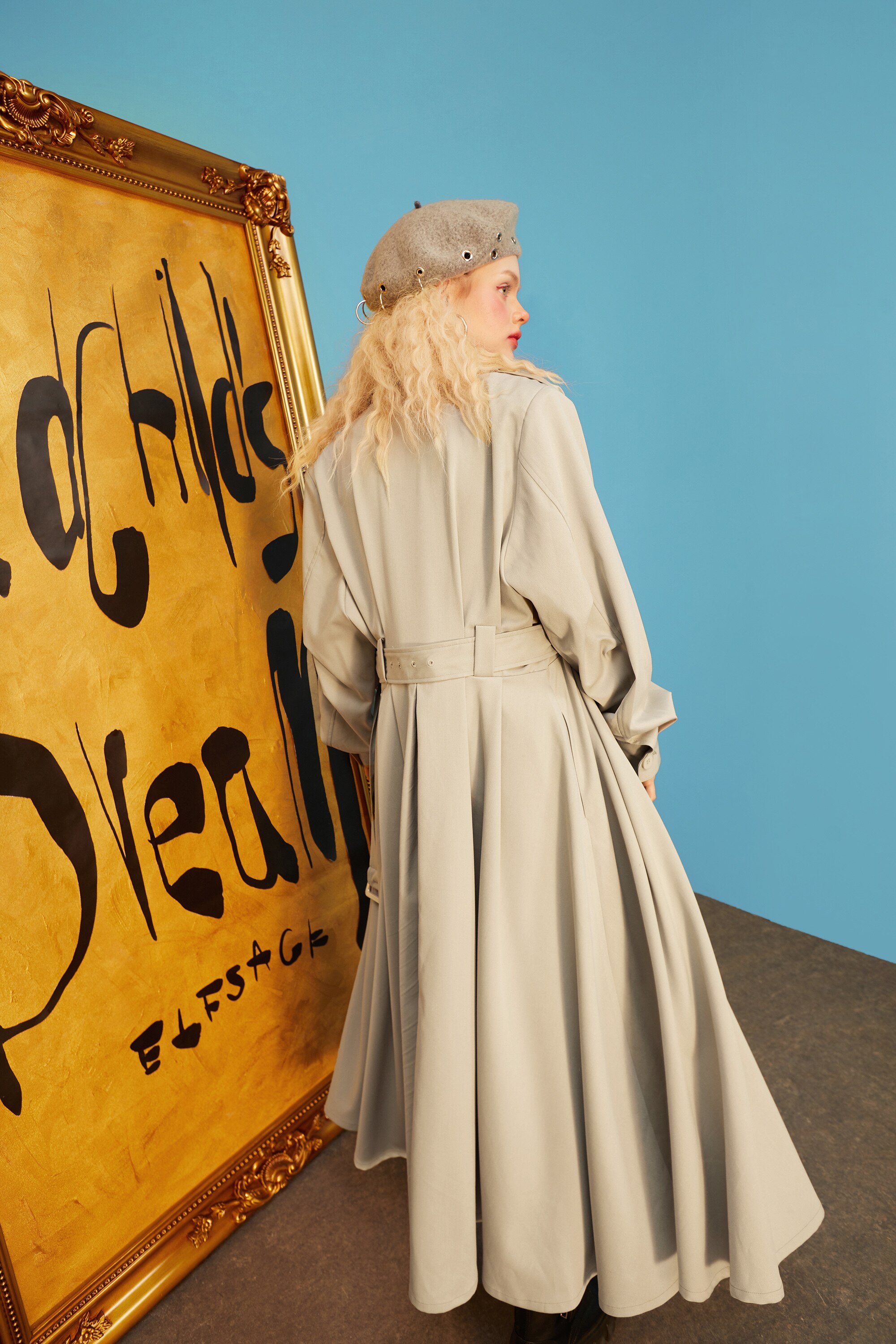 A stylish green oversize trench coat for women, featuring a single-breasted closure and full sleeves, perfect for spring and autumn wear.