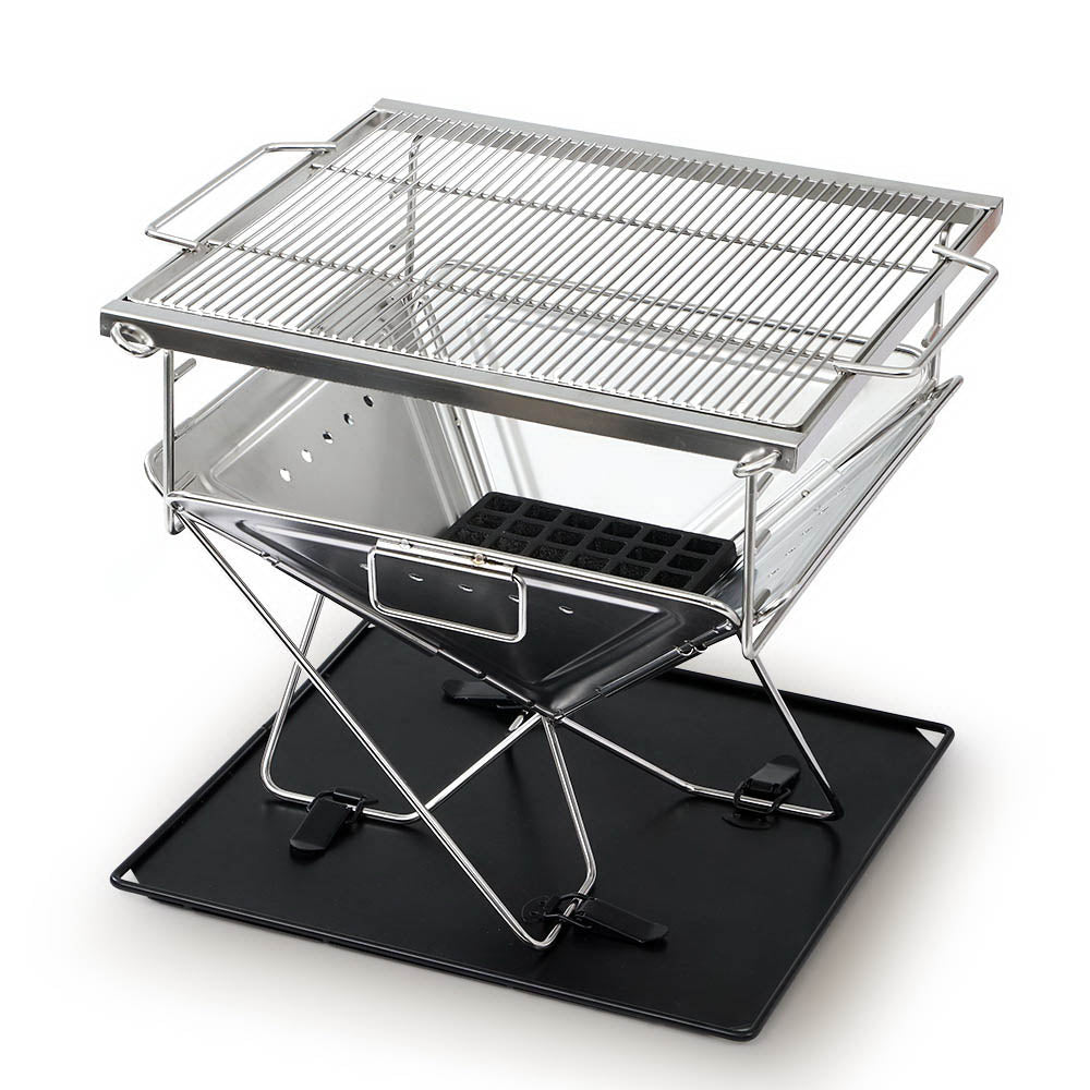 Grillz Portable Fire Pit BBQ made of stainless steel, featuring a height-adjustable grill rack and a carry bag, ideal for outdoor cooking.