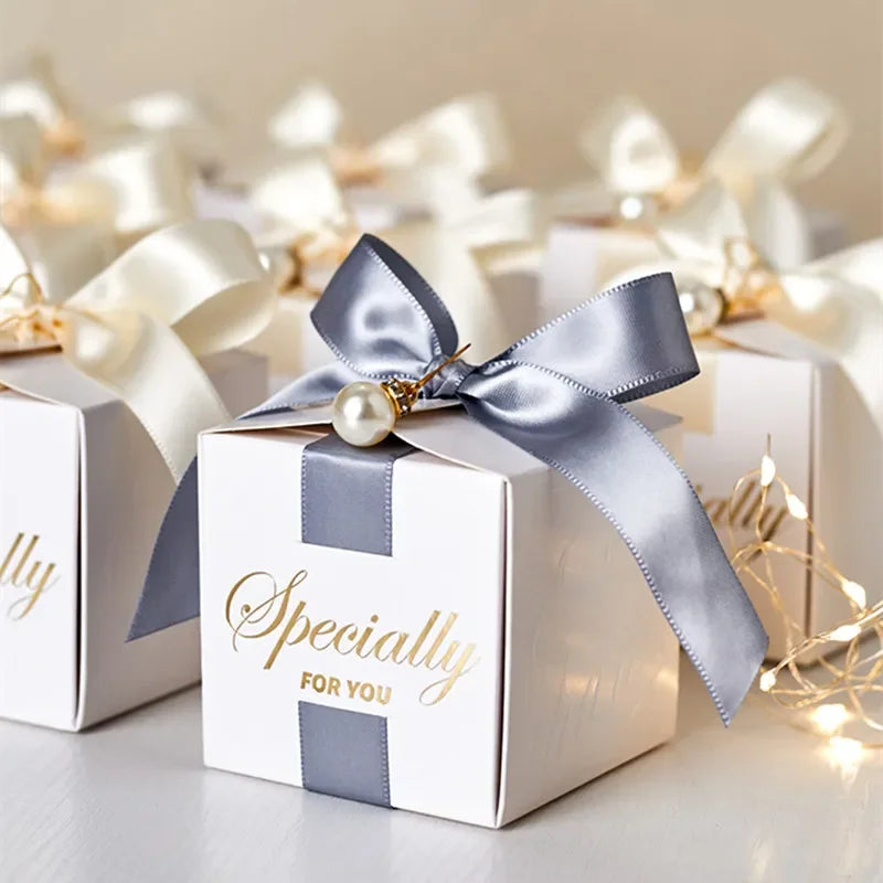 High quality square candy boxes decorated with pearls and ribbons, ideal for weddings and special occasions, showcasing elegant design and sturdy construction.