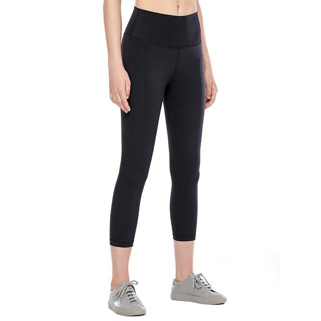 High Waisted Capri Workout Leggings for Women in black, featuring a snug fit and elastic waist, perfect for athletic activities.