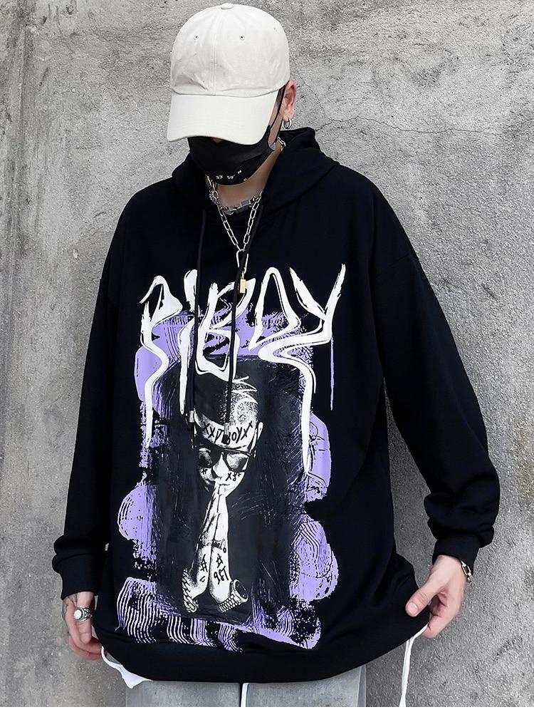 A stylish black hoodie featuring a vibrant graffiti print, designed for men and youth, perfect for high street fashion.